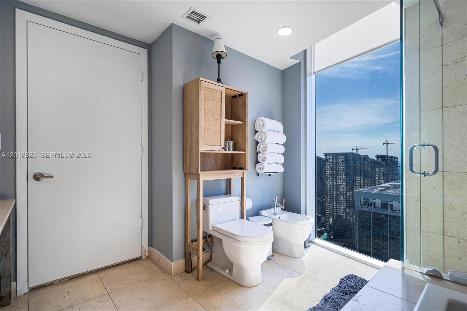 495 Brickell Avenue, Unit 4911 Miami, FL 33131 - Photo 30 of 35 a bathroom with a toilet and a shower