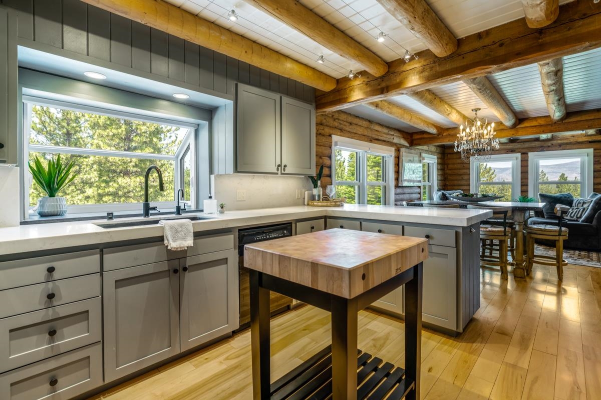 10734 Chickwick Reach Truckee, CA 96161 - Photo 6 of 21 a kitchen with a table chairs and a wooden floor