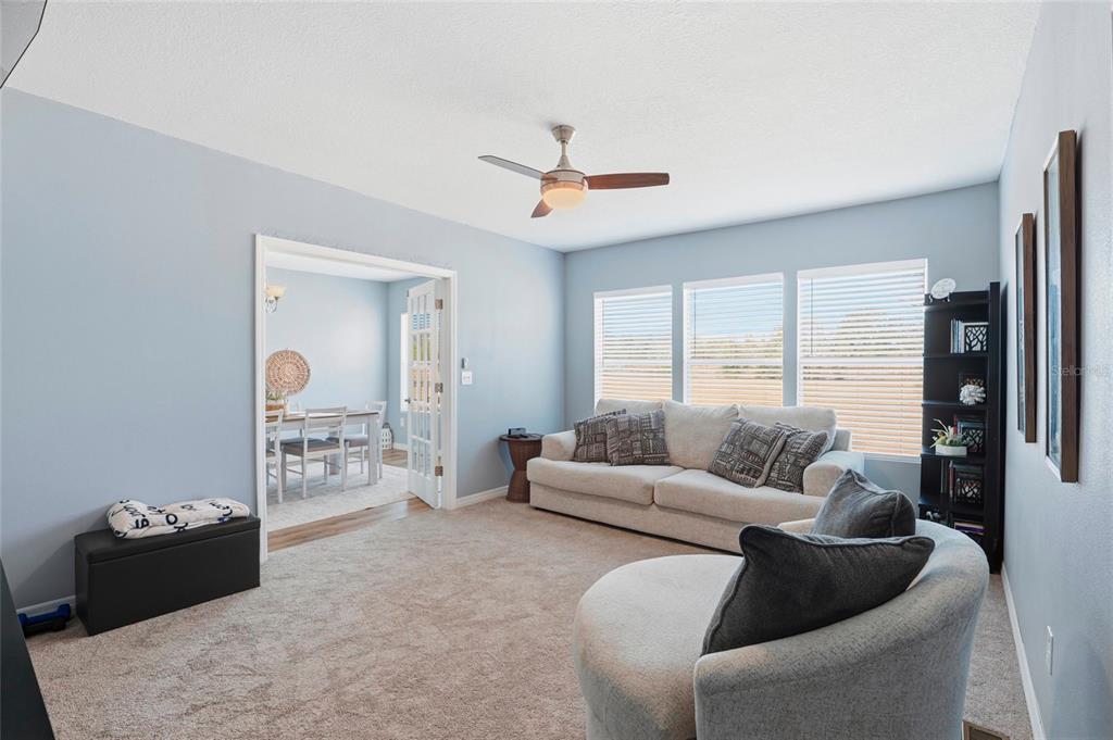 952 Gallilee Loop Lake City, FL 32024 - Photo 21 of 60 a living room with furniture and a table