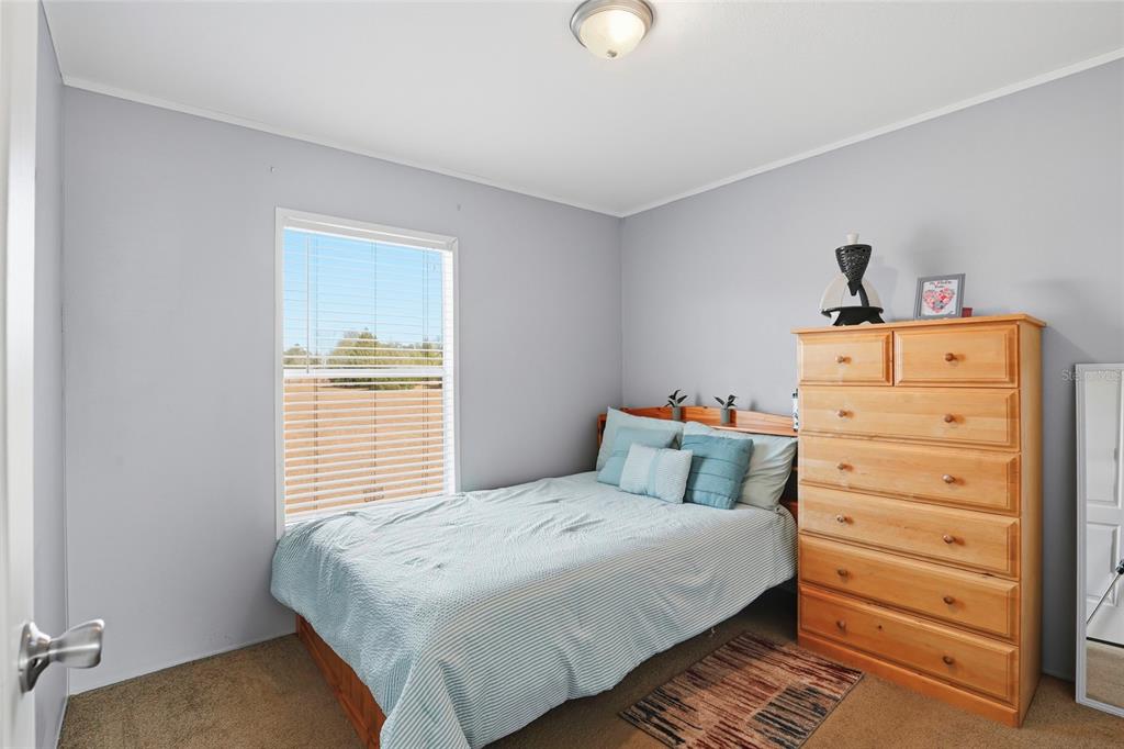 952 Gallilee Loop Lake City, FL 32024 - Photo 26 of 60 a bedroom with a bed and a window