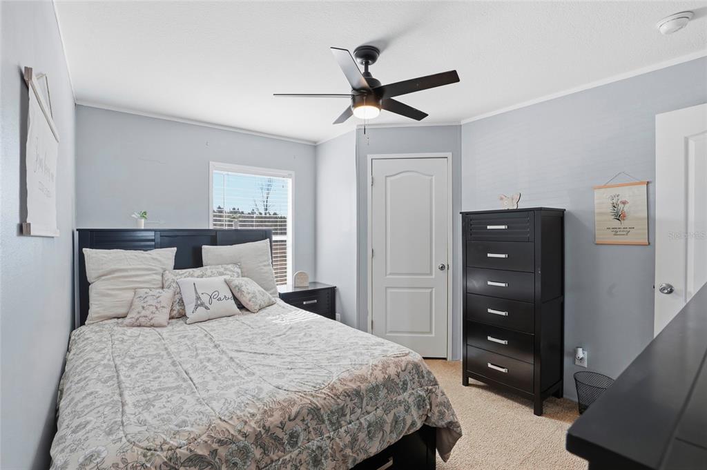 952 Gallilee Loop Lake City, FL 32024 - Photo 28 of 60 a bedroom with a bed and a ceiling fan