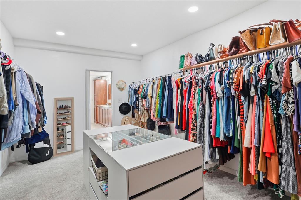 952 Gallilee Loop Lake City, FL 32024 - Photo 37 of 60 a view of walk in closet with clothes