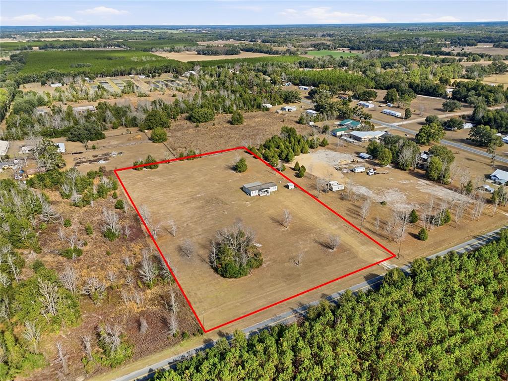 952 Gallilee Loop Lake City, FL 32024 - Photo 48 of 60 an aerial view of residential houses with outdoor space