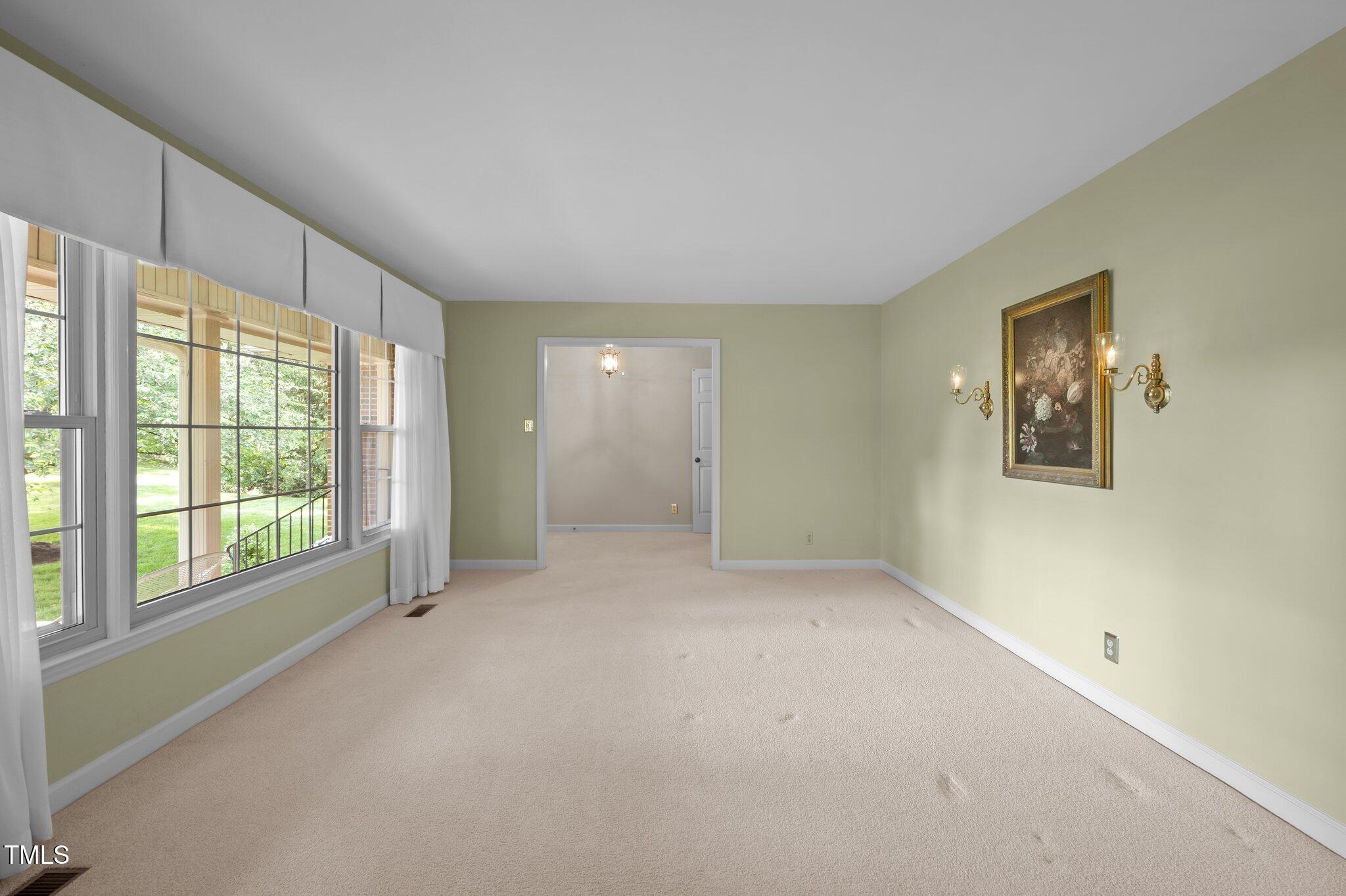 913 Milton Road Durham, NC 27712 - Photo 8 of 29 an empty room with windows