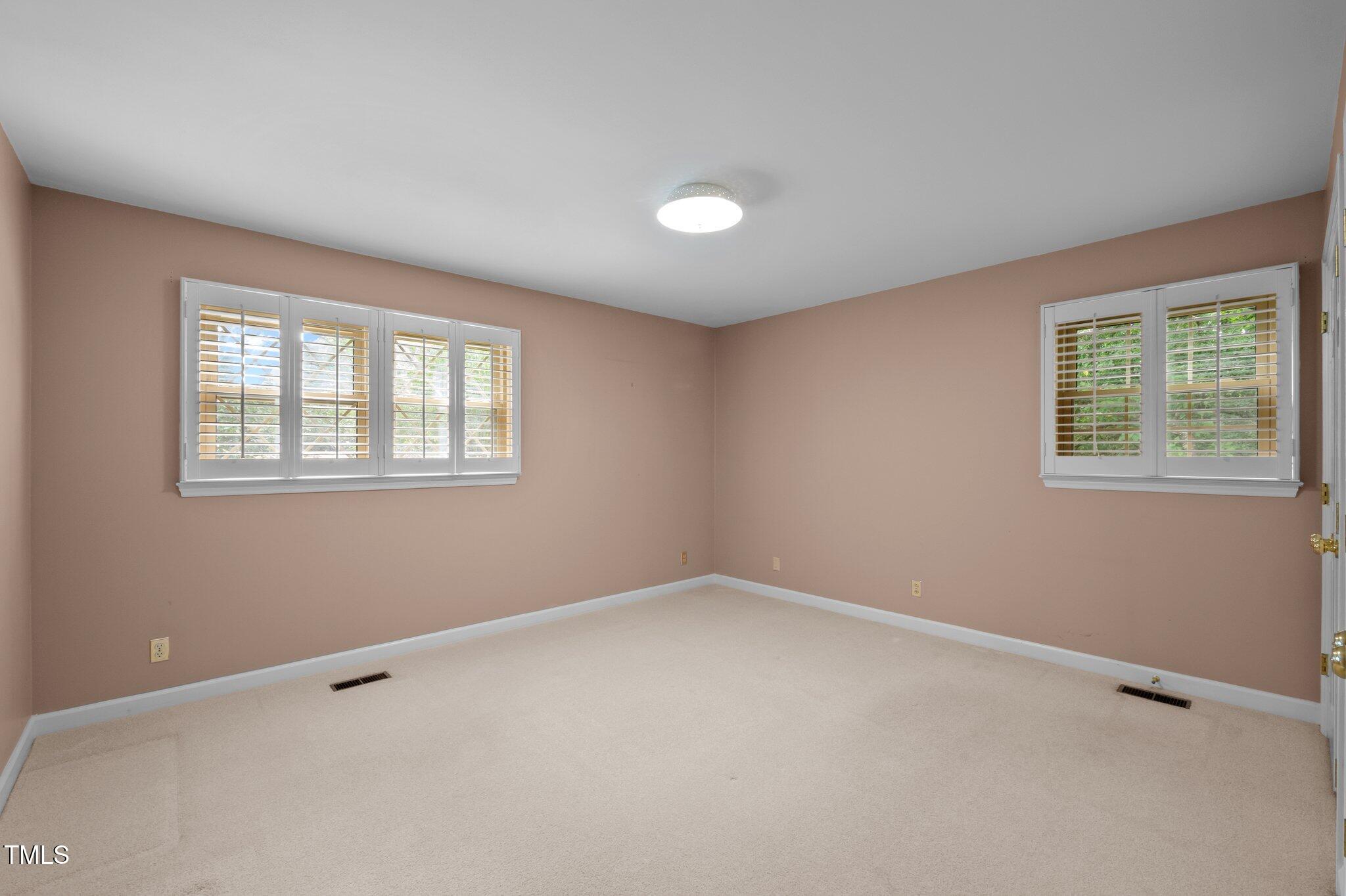 913 Milton Road Durham, NC 27712 - Photo 19 of 29 an empty room with windows