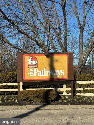 a view of a entryway door front of house with wooden floor