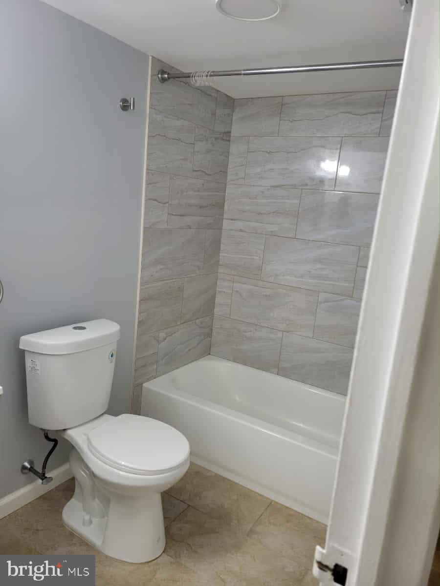 9921 Bustleton Avenue, Unit P2 Philadelphia, PA 19115 - Photo 5 of 10 a bathroom with a toilet and a shower