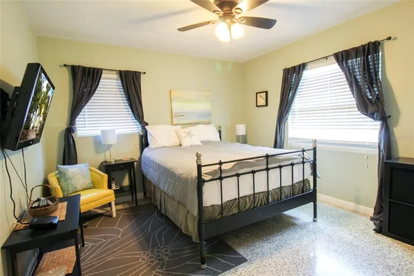 a bathroom with a granite countertop shower a toilet and a shower