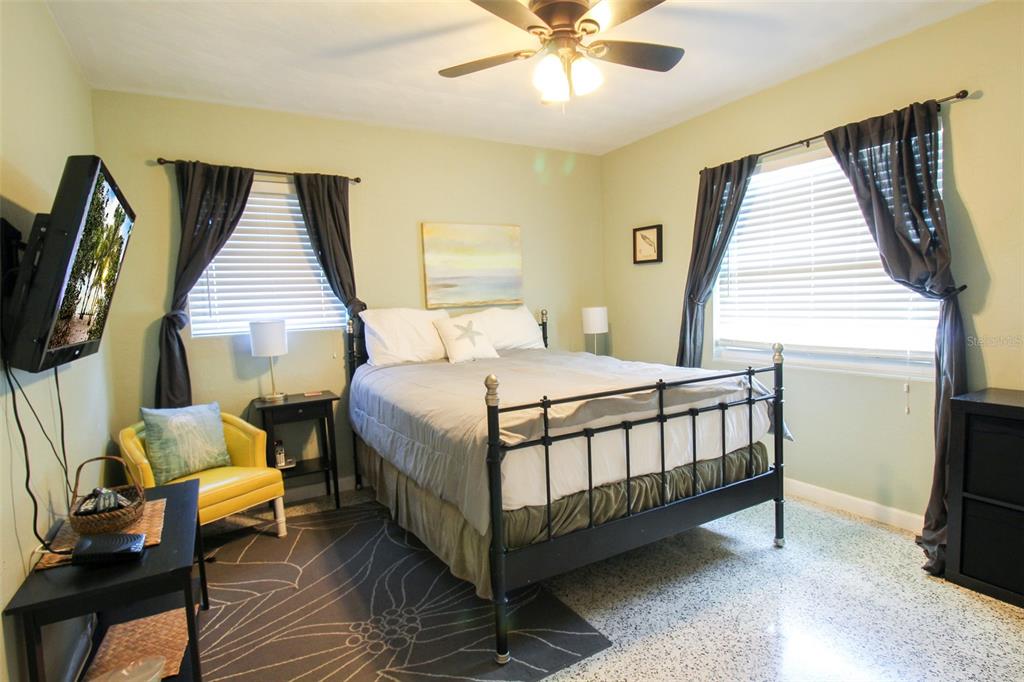 Undisclosed Address Venice, FL 34285 - Photo 14 of 63 a bedroom with a bed and wooden floor