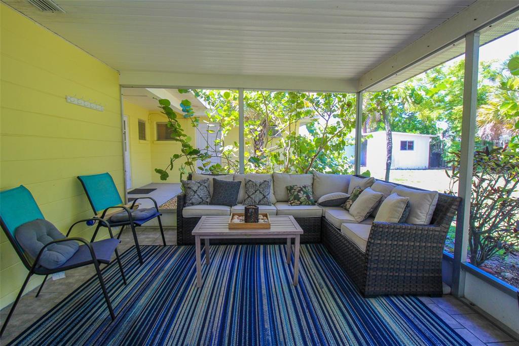 Undisclosed Address Venice, FL 34285 - Photo 23 of 63 a outdoor living space with furniture and wooden floor