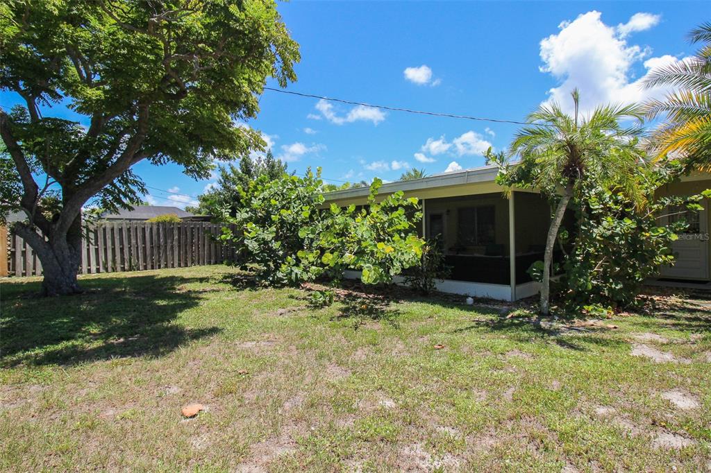 Undisclosed Address Venice, FL 34285 - Photo 24 of 63 a view of a house with backyard and a tree