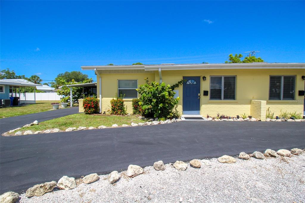Undisclosed Address Venice, FL 34285 - Photo 35 of 63 a front view of a house with a yard with yellow lighting