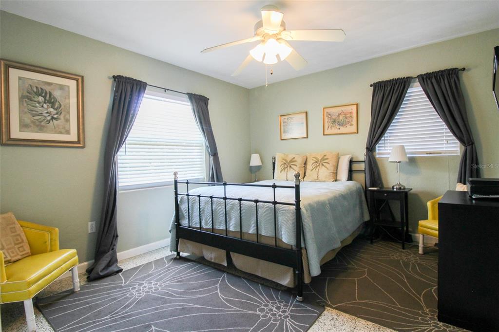 Undisclosed Address Venice, FL 34285 - Photo 42 of 63 a spacious bedroom with a bed and a couch