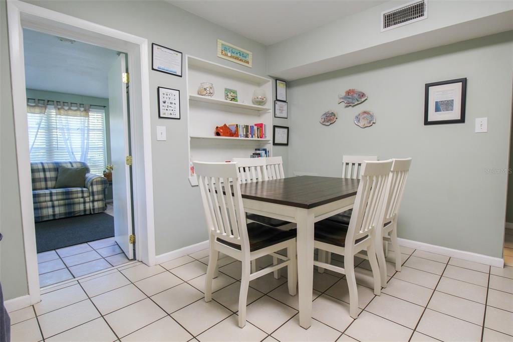 Undisclosed Address Venice, FL 34285 - Photo 49 of 63 a view of a dining room with furniture and a chandelier
