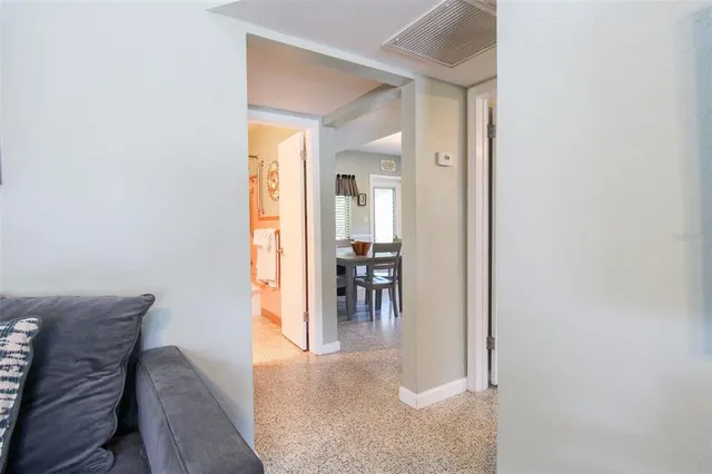 a kitchen with stainless steel appliances kitchen island granite countertop a stove a sink and a refrigerator