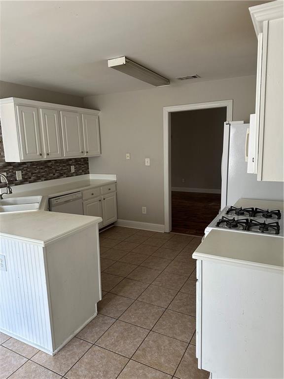 5630 Saltcreek PIace Northeast Sugar Hill, GA 30518 - Photo 3 of 10 a kitchen with sink a stove and refrigerator