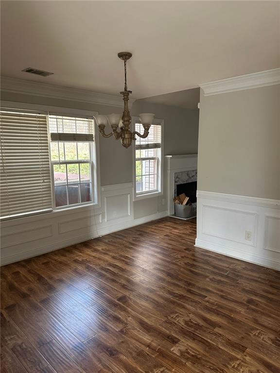 5630 Saltcreek PIace Northeast Sugar Hill, GA 30518 - Photo 4 of 10 a view of empty room with wooden floor and fan