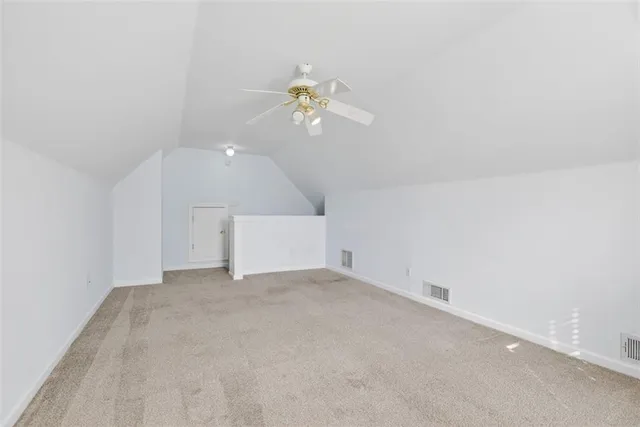 a view of a ceiling fan and window