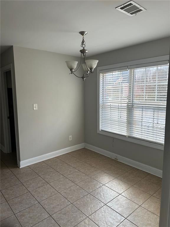 5630 Saltcreek PIace Northeast Sugar Hill, GA 30518 - Photo 5 of 10 a view of an empty room with a window