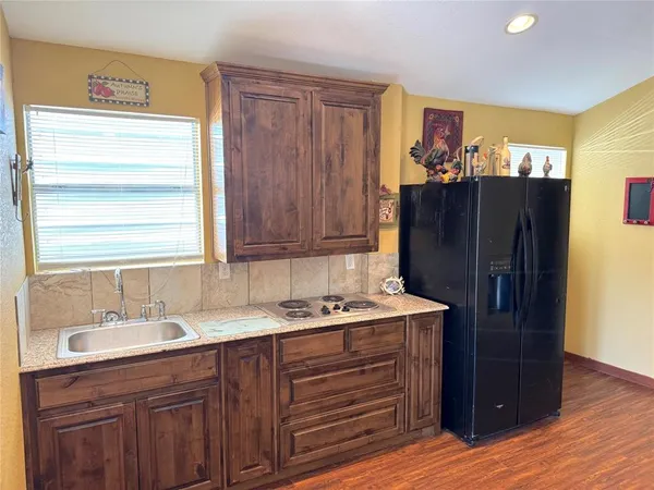 a bathroom with a sink vanity and a mirror