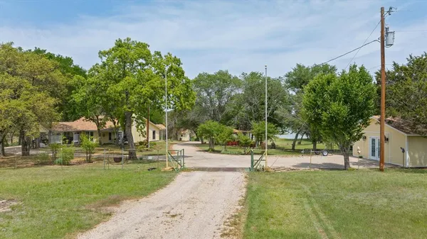 a view of a street with houses on the side