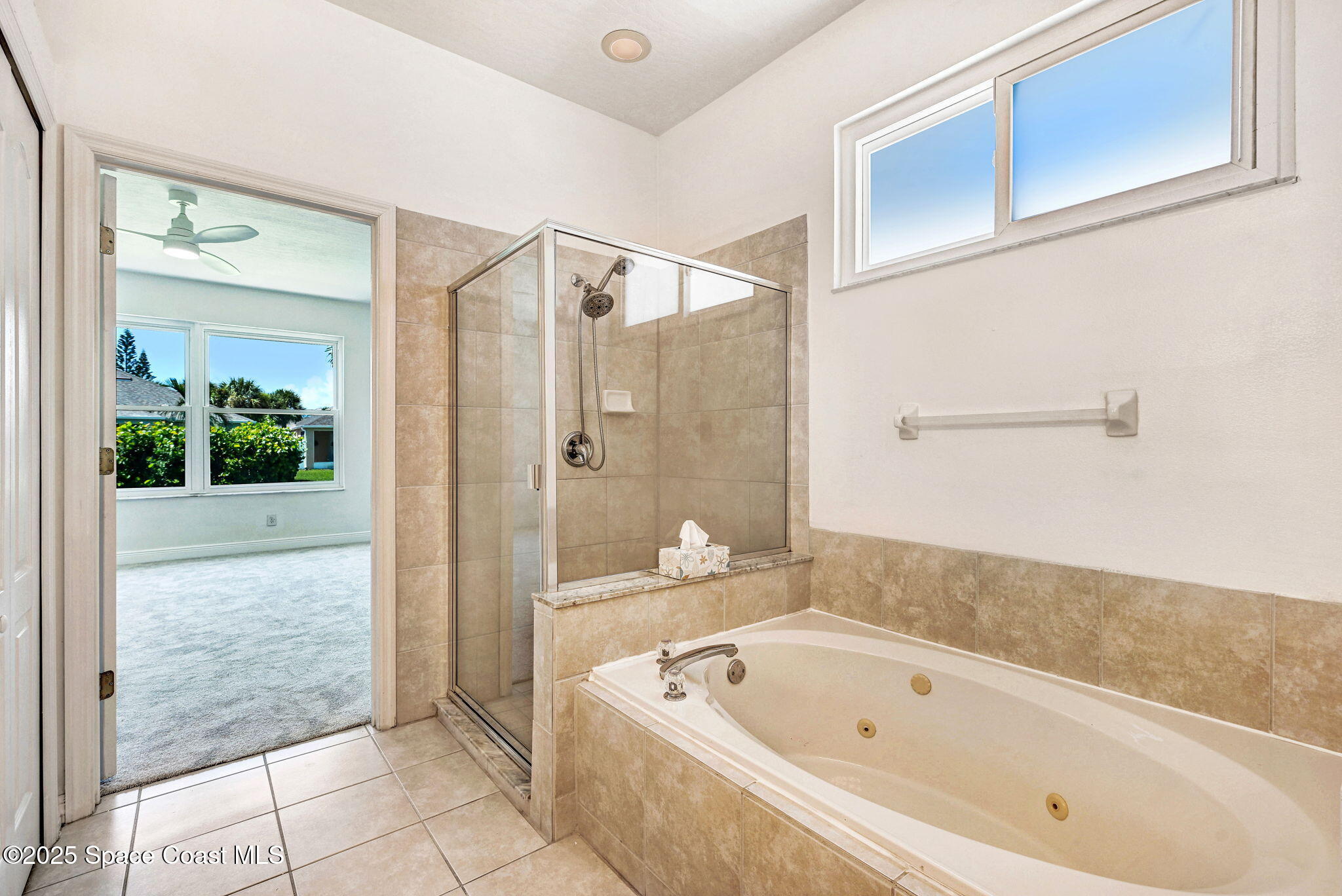165 Calico Lane Indialantic, FL 32903 - Photo 13 of 25 a bathroom with a bathtub and shower