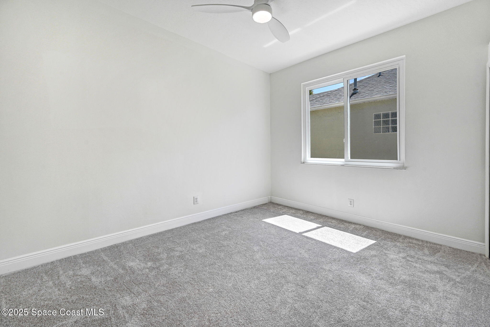 165 Calico Lane Indialantic, FL 32903 - Photo 15 of 25 an empty room with a window