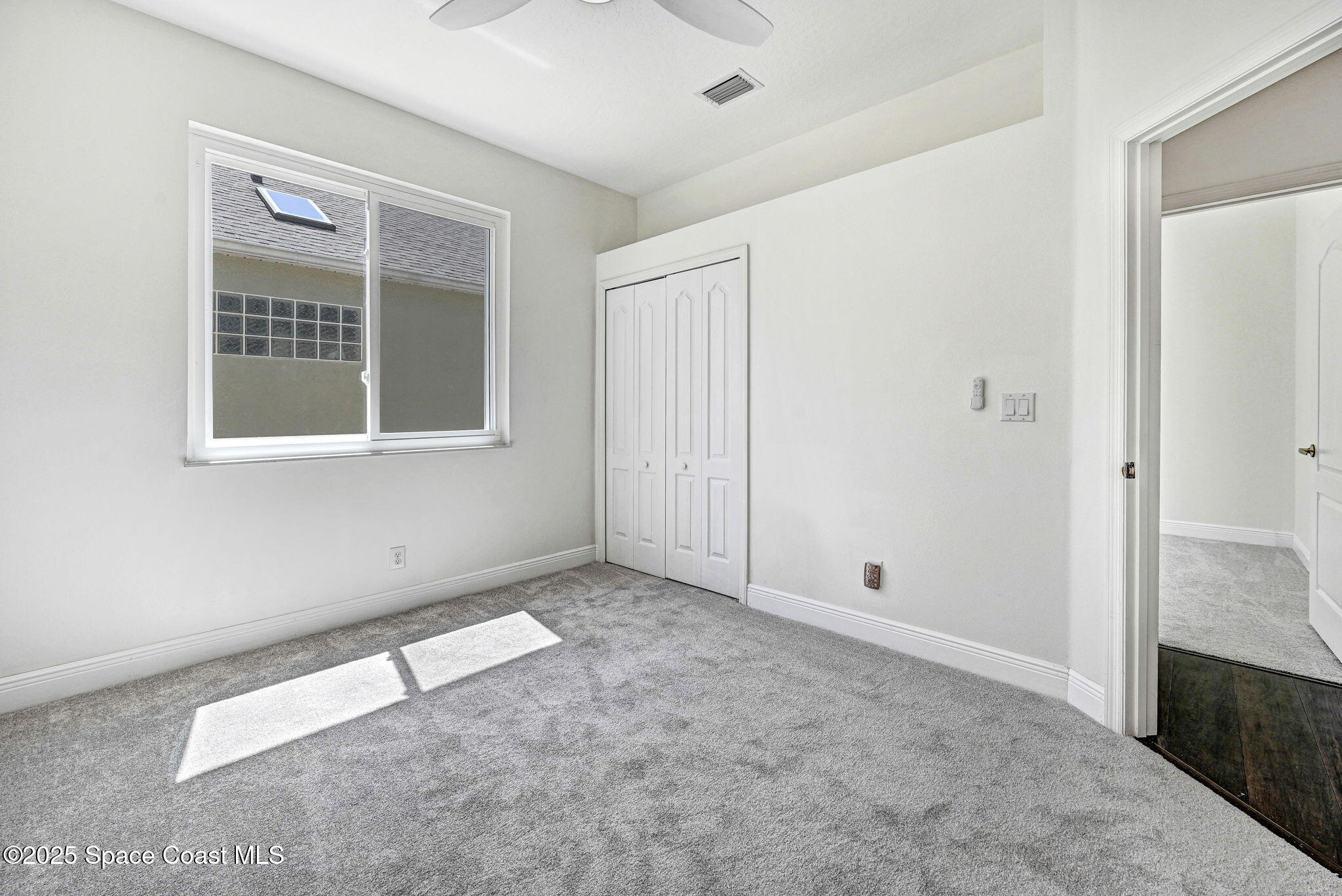 165 Calico Lane Indialantic, FL 32903 - Photo 16 of 25 an empty room with windows