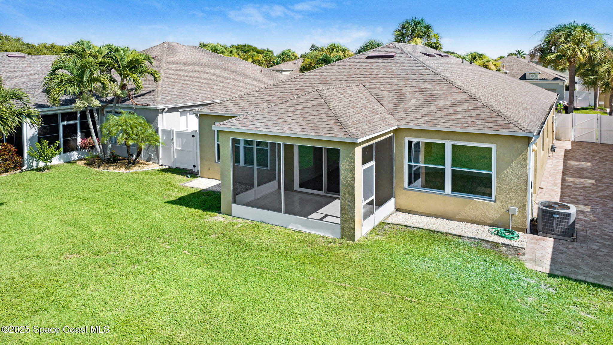 165 Calico Lane Indialantic, FL 32903 - Photo 20 of 25 a view of a house with a yard and porch