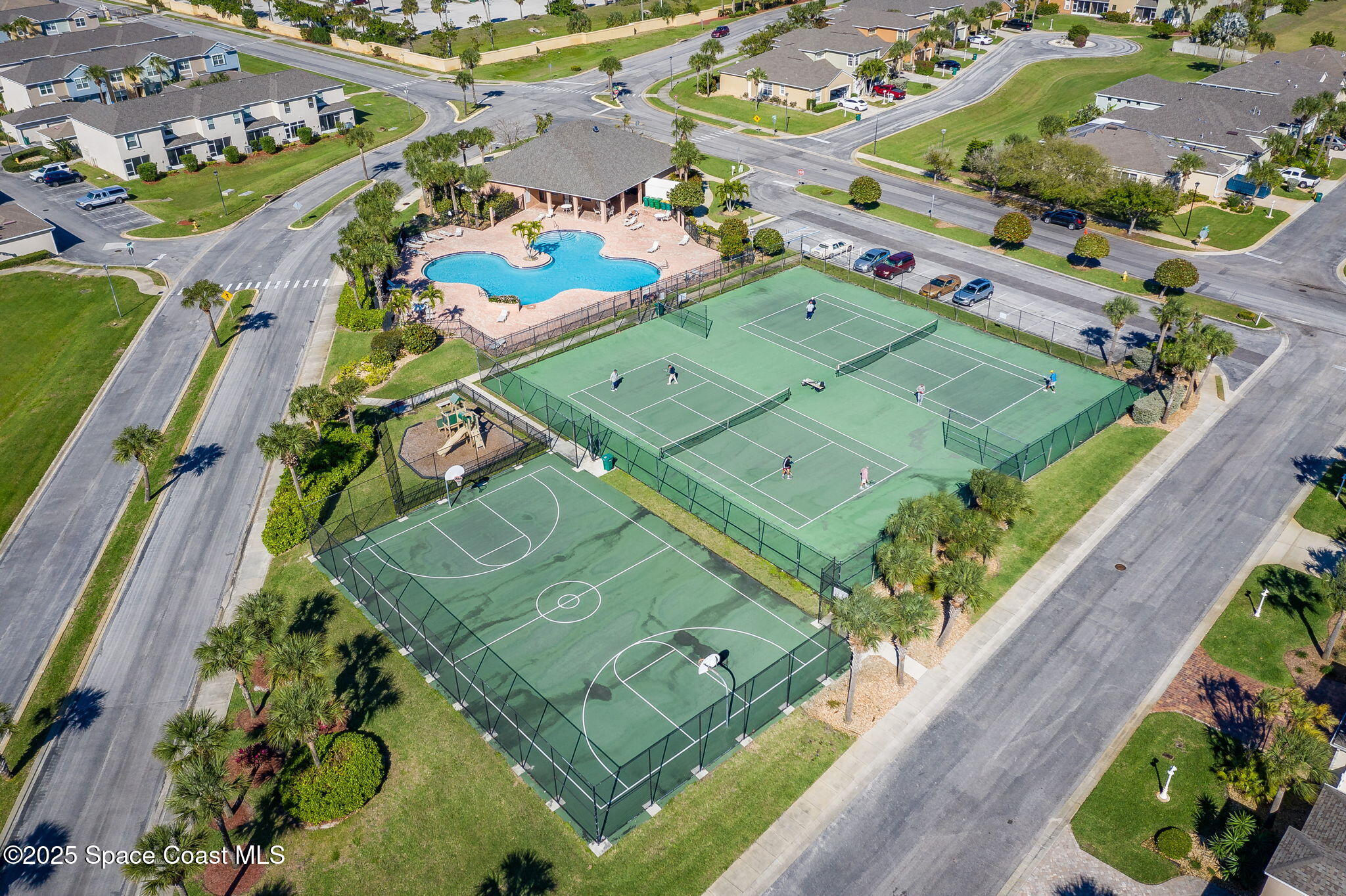 165 Calico Lane Indialantic, FL 32903 - Photo 25 of 25 an aerial view of a tennis ground and a cars park side of the road