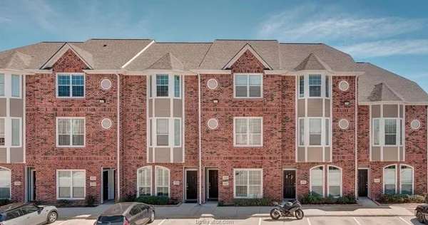 a front view of a building with a street