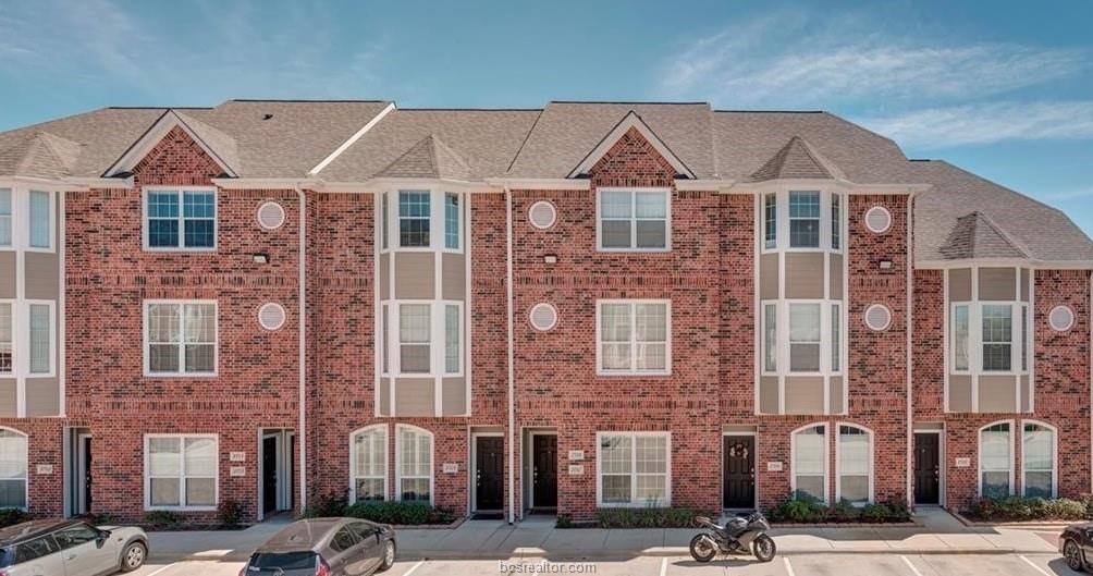 a front view of a building with a street