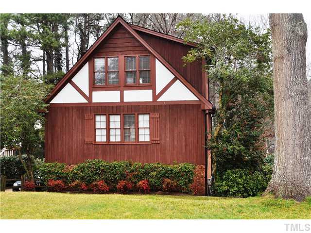 7528 Fiesta Way Raleigh, NC 27615 - Photo 2 of 22 a front view of a house with a yard