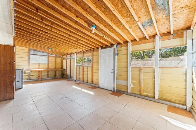 a view of an empty room with windows