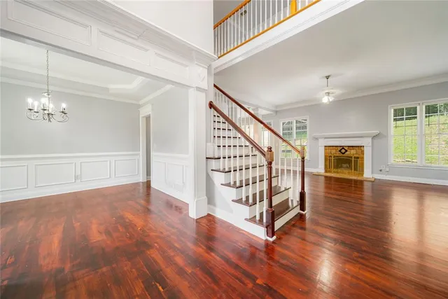 a view of entryway with stairs and wooden floor