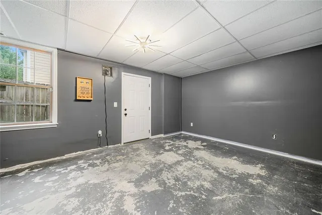 a view of an empty room with windows