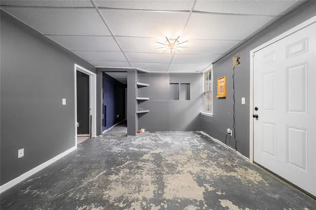 a view of an empty room with a chandelier