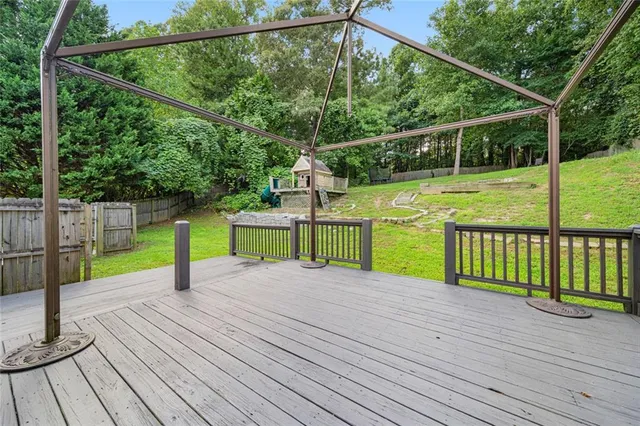 a view of a deck with a yard