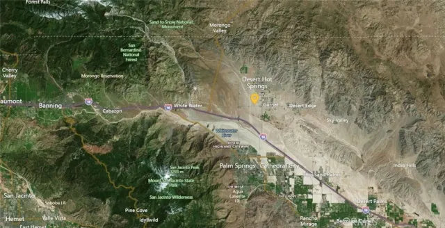 a backyard of a building with large trees