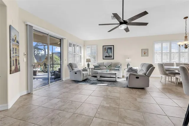 a spacious bedroom with a bed and a flat screen tv