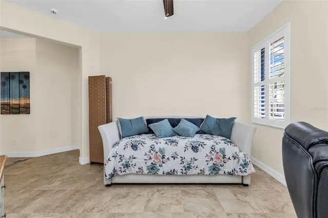 a bedroom with a bed and window