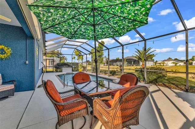 a view of a swimming pool with a patio