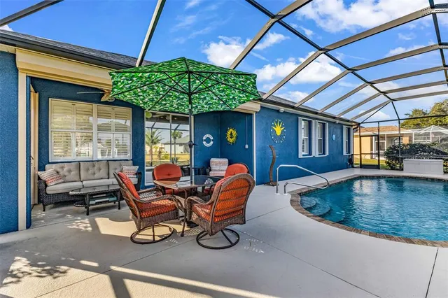 a view of a porch with a table and chairs