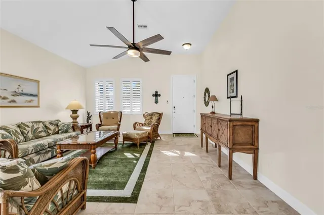 a living room with furniture and a window