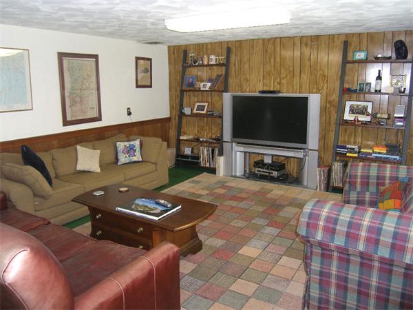 25 Jeffrey Road Wayland, MA 01778 - Photo 13 of 16 a living room with furniture and a flat screen tv