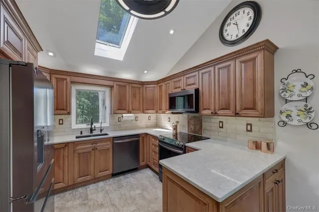 a kitchen with a sink cabinets and window