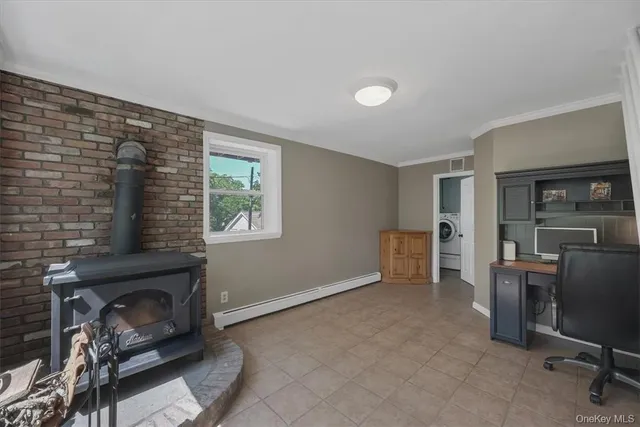 a view of a livingroom with furniture and a window