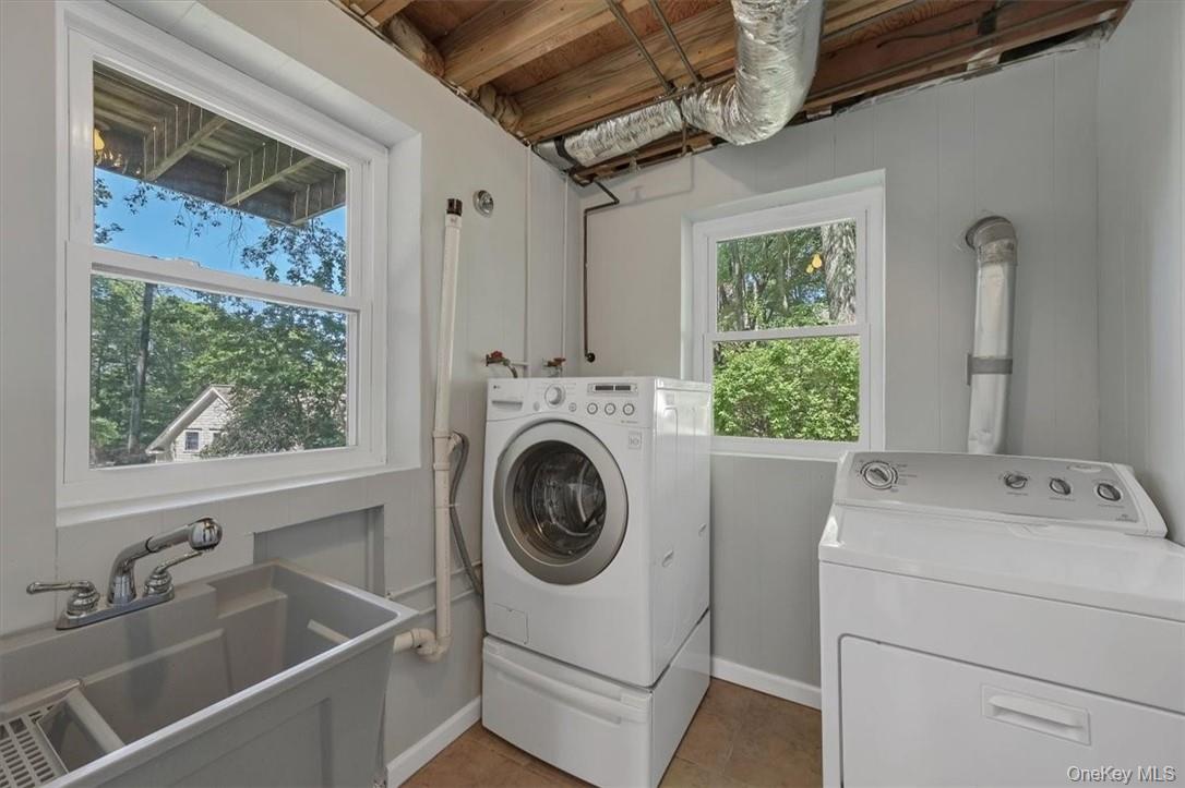 13 Split Rock Road Mahopac, NY 10541 - Photo 28 of 36 a utility room with dryer and washer