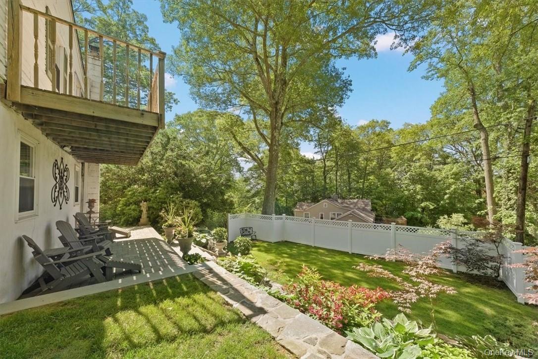 13 Split Rock Road Mahopac, NY 10541 - Photo 32 of 36 a backyard of a house with table and chairs