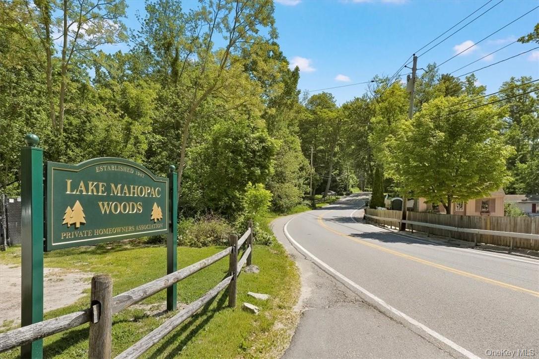 13 Split Rock Road Mahopac, NY 10541 - Photo 34 of 36 a view of a swimming pool with a bench